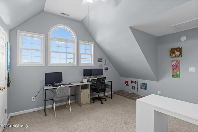 office space with ceiling fan, light colored carpet, and vaulted ceiling