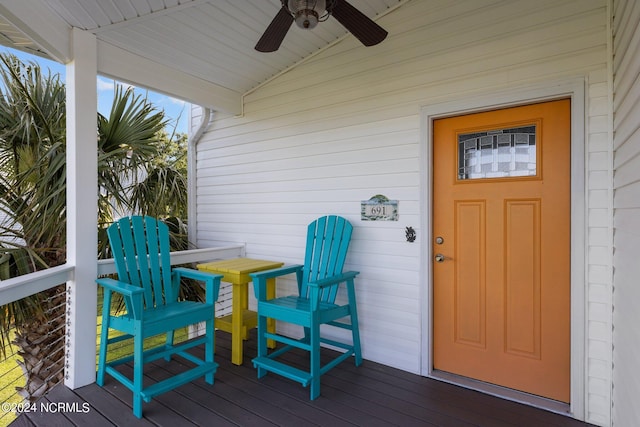 deck featuring covered porch and ceiling fan