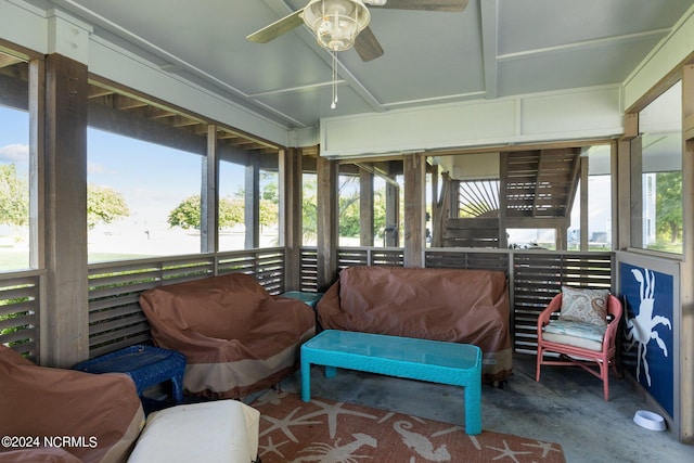 sunroom / solarium featuring ceiling fan