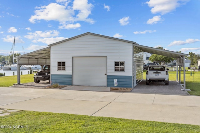 garage featuring a lawn