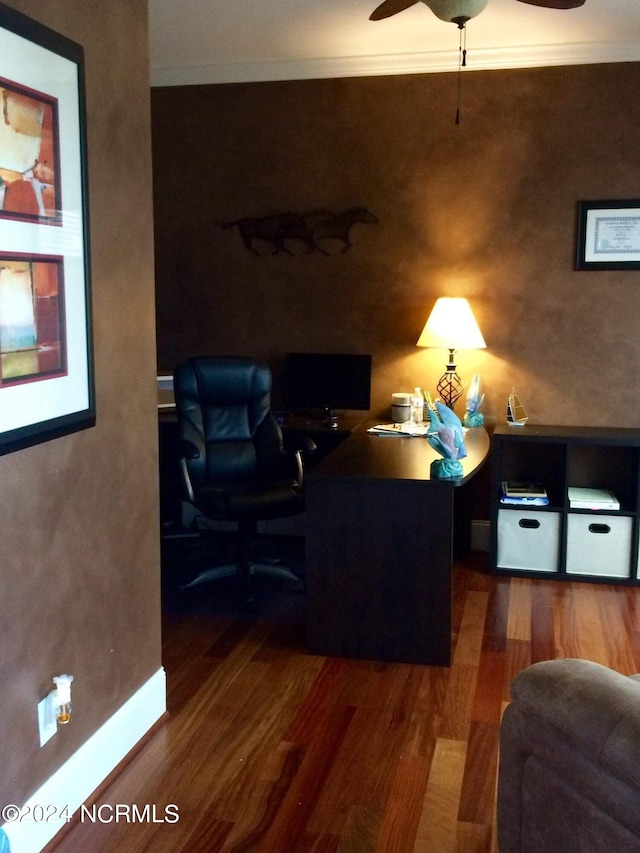 home office featuring crown molding, dark hardwood / wood-style flooring, and ceiling fan