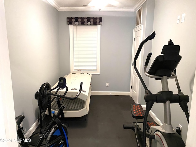 workout room with ornamental molding