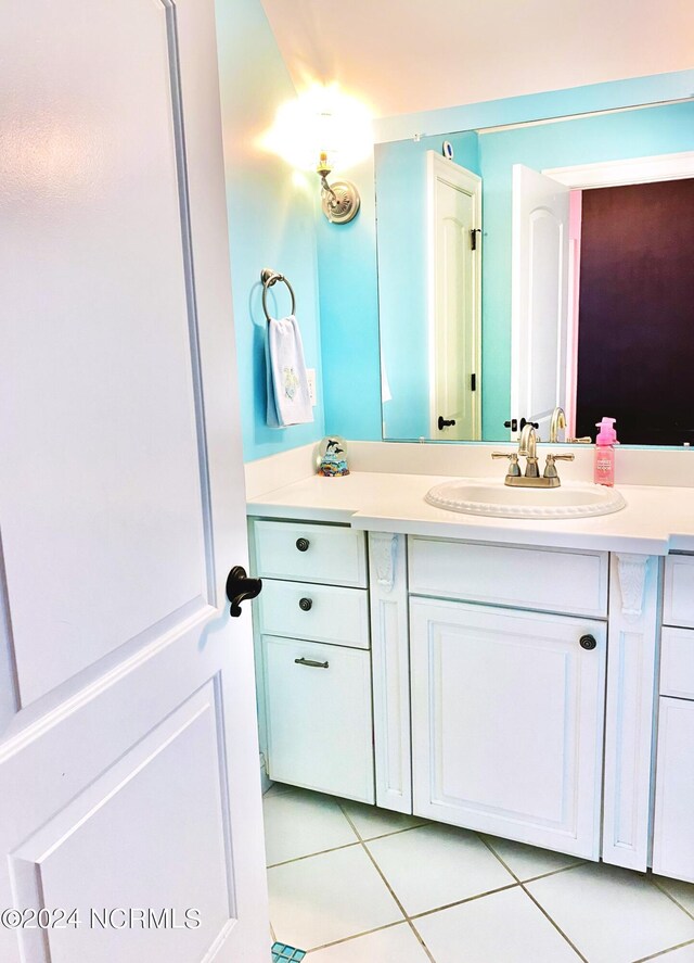 bathroom with vanity and tile patterned floors