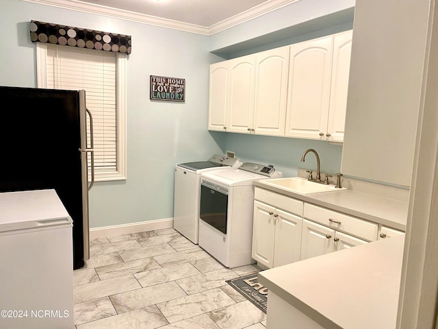 laundry room with sink, cabinets, crown molding, light tile patterned flooring, and separate washer and dryer