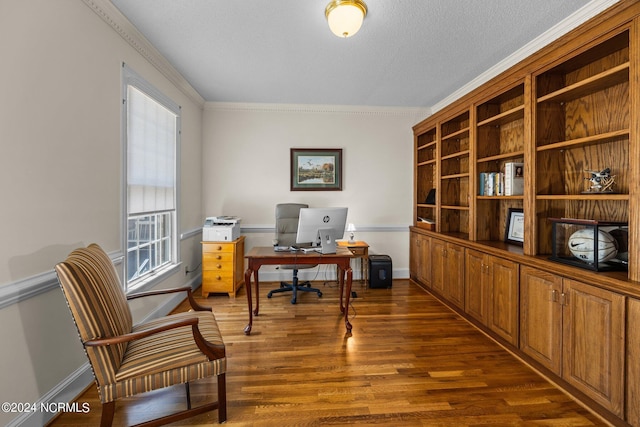 office area with ornamental molding, dark hardwood / wood-style flooring, and a textured ceiling