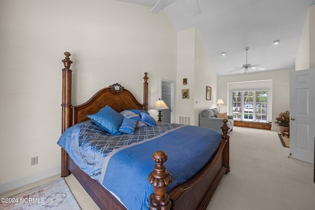 carpeted bedroom with vaulted ceiling and ceiling fan