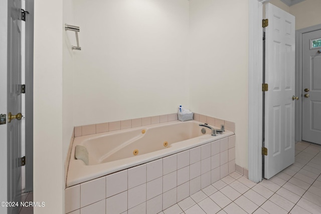 bathroom featuring tiled tub and tile patterned floors