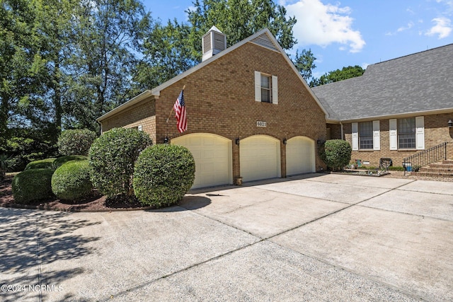 view of side of home with a garage