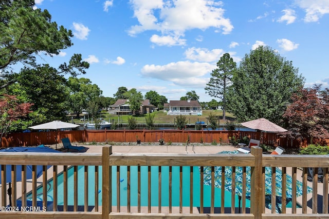 exterior space featuring a fenced in pool