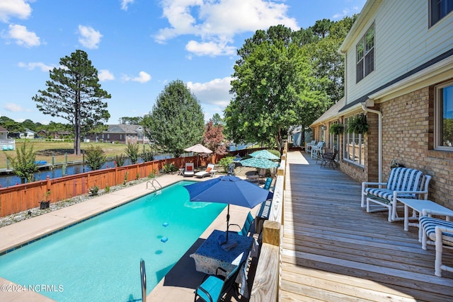 view of pool with a wooden deck