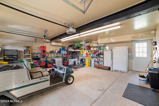 garage featuring a garage door opener and freestanding refrigerator