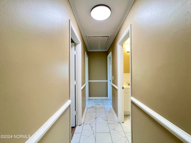 hallway featuring crown molding