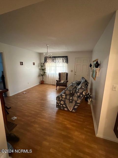 dining space with a notable chandelier and wood-type flooring