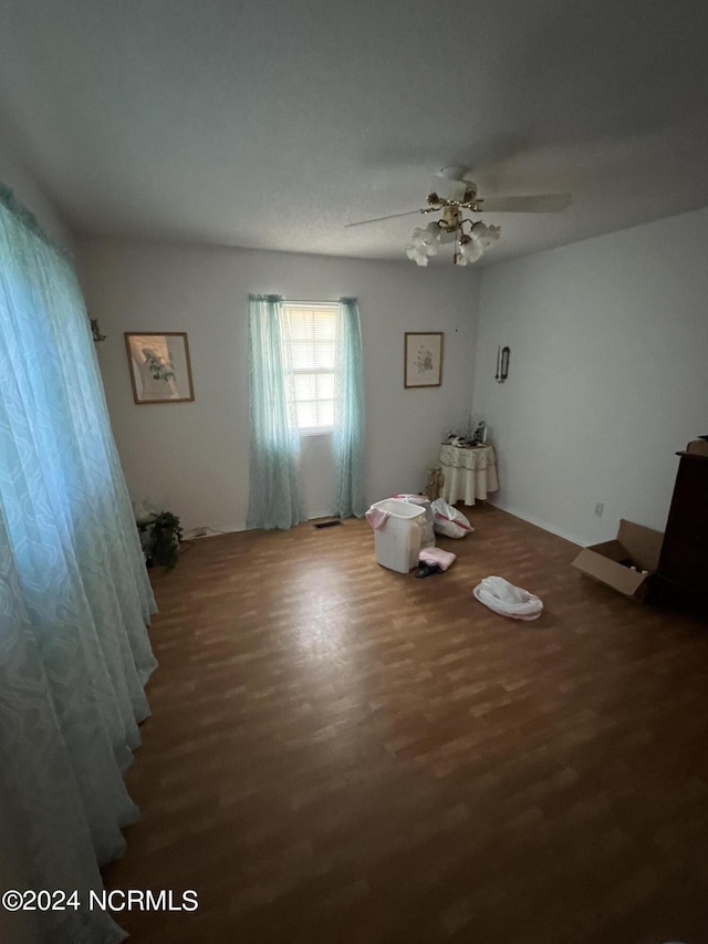 interior space featuring hardwood / wood-style floors and ceiling fan