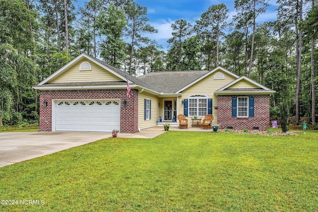 ranch-style house featuring a front lawn and a garage