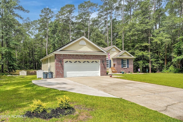 ranch-style home with a front yard and a garage