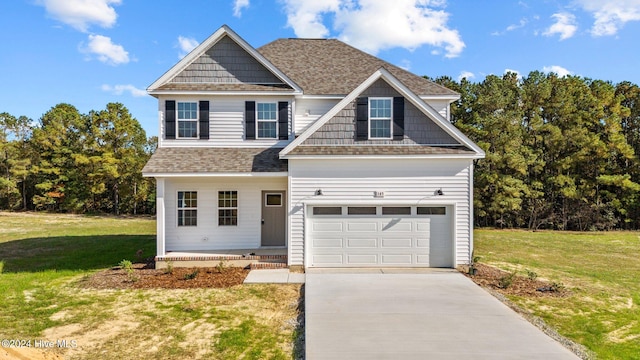 craftsman-style home featuring a garage and a front lawn