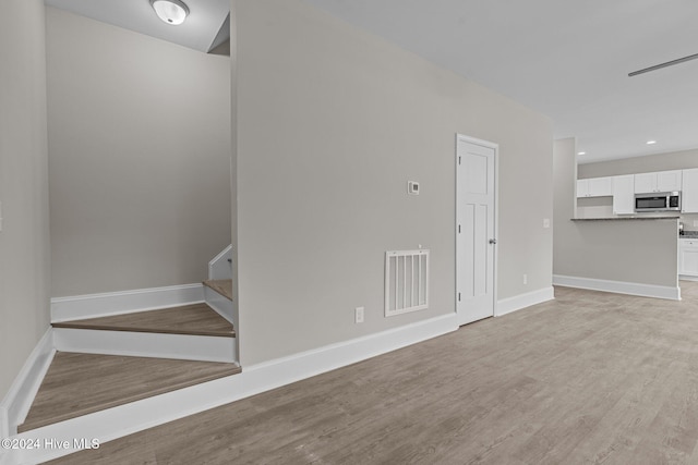 unfurnished living room featuring light hardwood / wood-style flooring