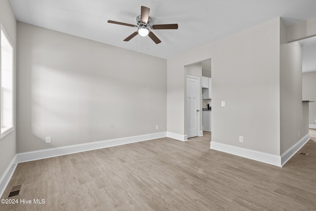 unfurnished room featuring ceiling fan and light hardwood / wood-style flooring