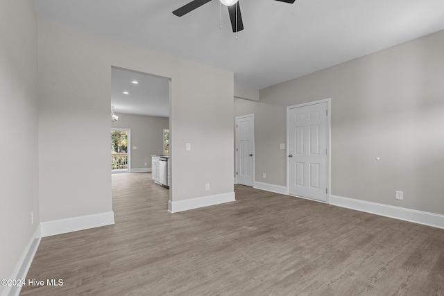 spare room featuring light hardwood / wood-style floors and ceiling fan