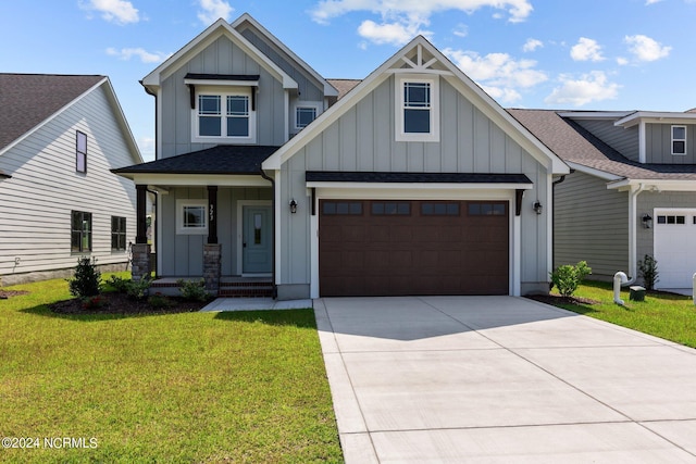 view of front of house featuring a garage and a front lawn