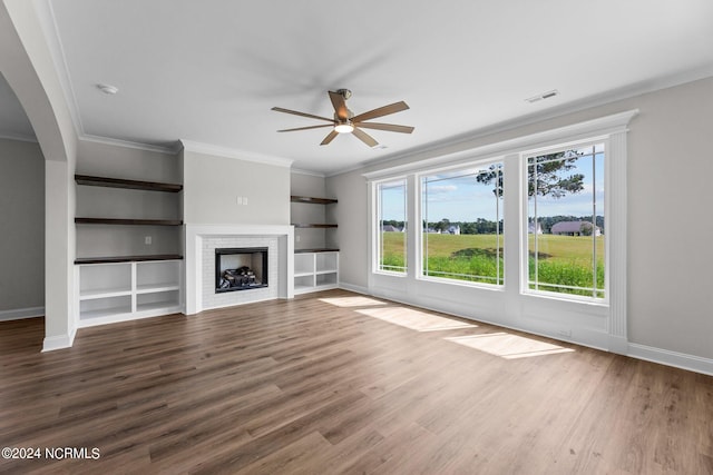 unfurnished living room featuring a fireplace, dark hardwood / wood-style flooring, and ceiling fan