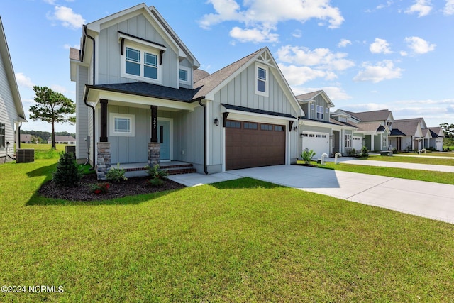 craftsman house featuring a garage, covered porch, and a front lawn