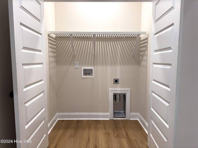 washroom featuring dark wood-type flooring, washer hookup, and electric dryer hookup