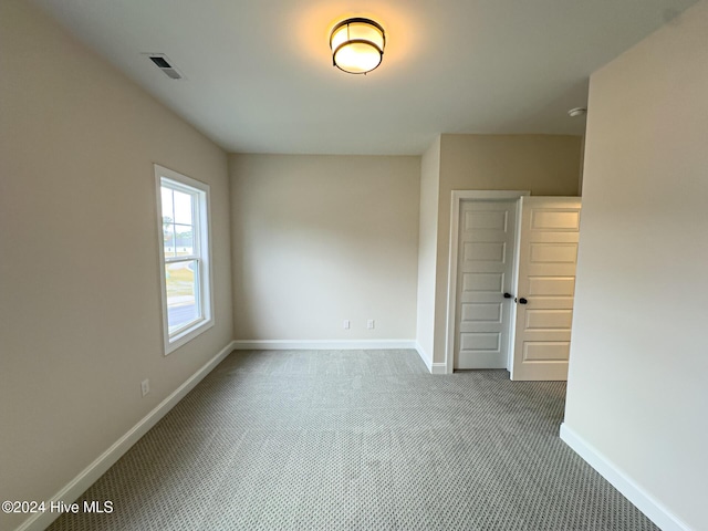 empty room featuring carpet floors