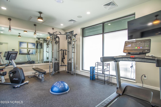 workout area with ceiling fan