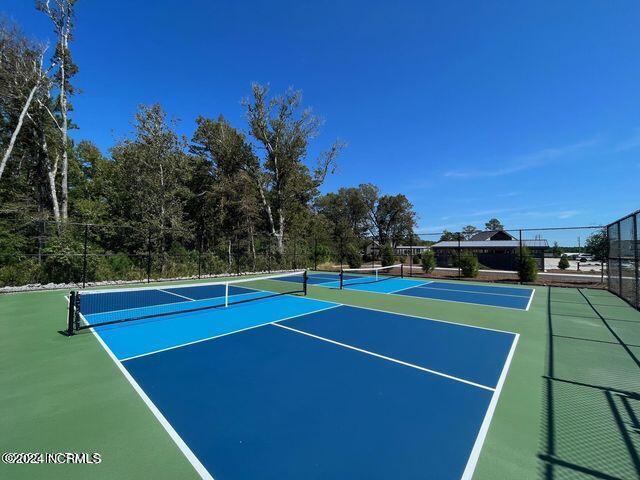 view of tennis court with basketball court