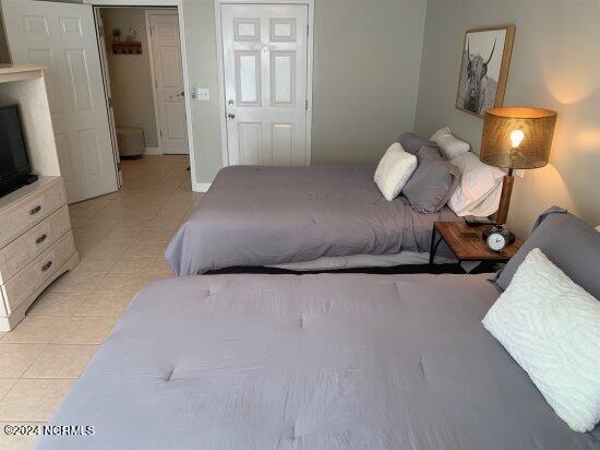 bedroom with light tile flooring