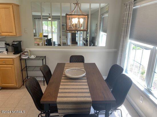 dining area featuring light tile floors