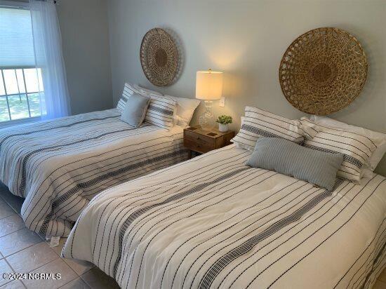 bedroom featuring tile floors