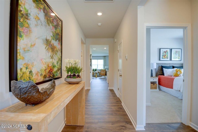 hallway with dark wood-type flooring