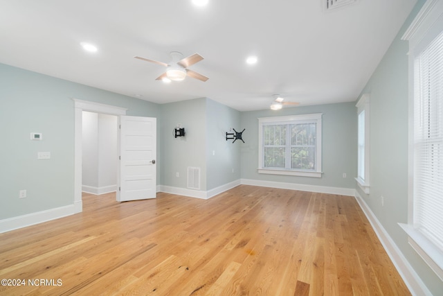 empty room featuring ceiling fan and light wood-type flooring