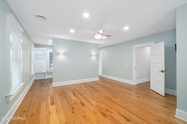 spare room with ceiling fan and light hardwood / wood-style flooring