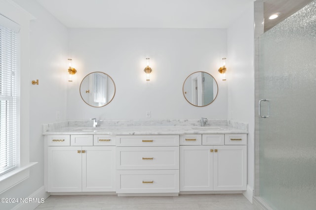 bathroom featuring vanity and walk in shower