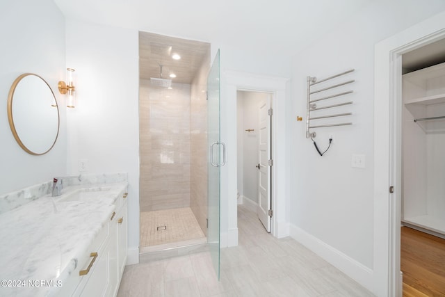 bathroom featuring vanity and walk in shower