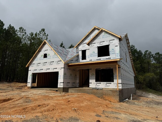 property in mid-construction with a garage