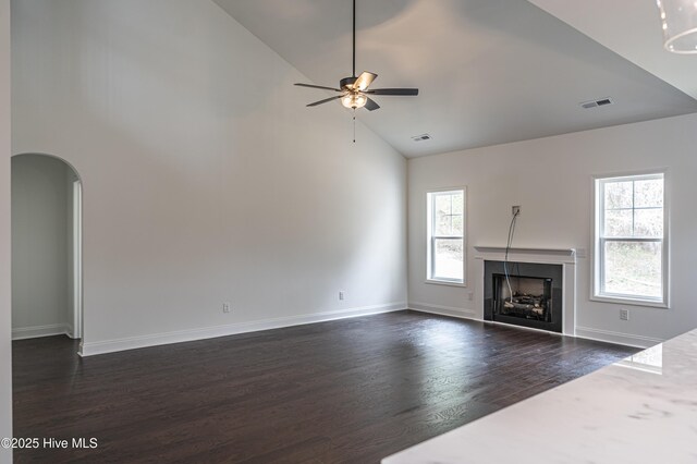 property in mid-construction featuring a garage, driveway, and a wooded view