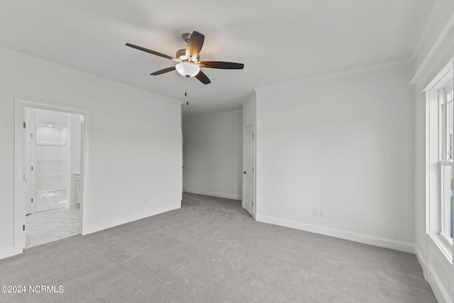 unfurnished bedroom with multiple windows, light colored carpet, and ceiling fan