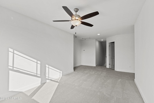 carpeted empty room featuring ceiling fan