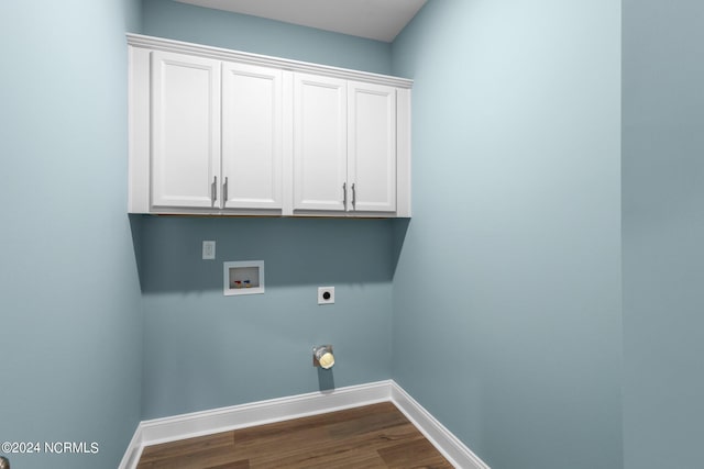 laundry room featuring washer hookup, cabinets, dark hardwood / wood-style floors, and electric dryer hookup