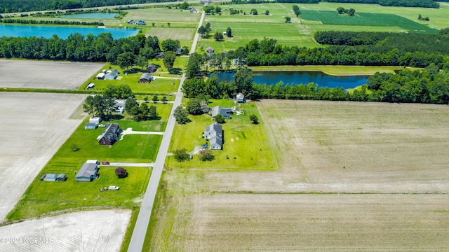 birds eye view of property with a water view and a rural view