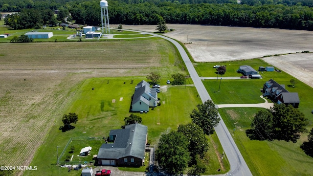 aerial view with a wooded view and a rural view