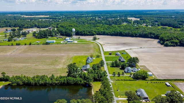 bird's eye view with a water view, a view of trees, and a rural view