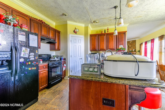 kitchen featuring ornamental molding, pendant lighting, under cabinet range hood, and black appliances