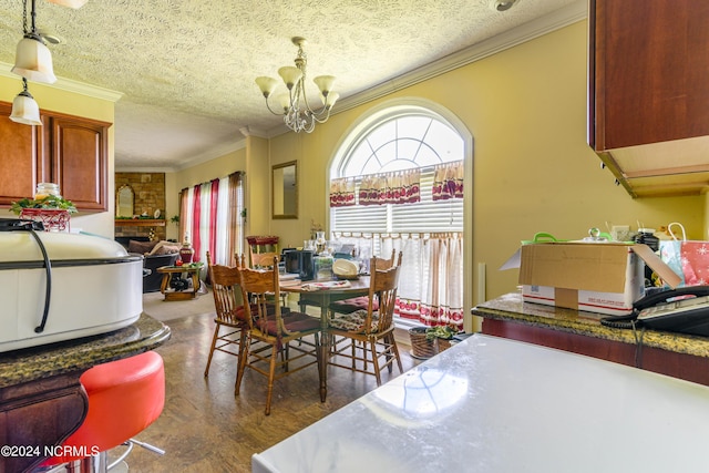 dining area with crown molding, a textured ceiling, and an inviting chandelier