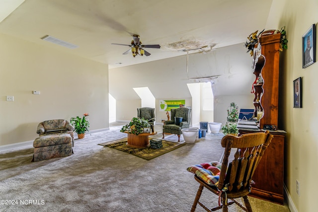 carpeted living area featuring ceiling fan, visible vents, and baseboards